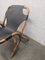 Butaca de relajación vintage de ratán con asiento de cuero negro, años 60, Imagen 9