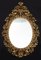 Specchio antico fiorentino di forma ovale in legno dorato e intagliato, inizio XX secolo, Immagine 1