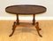Regency Oval Yew Wood Pie Crust Edge Coffee Table on Saber Feet 1