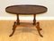 Regency Oval Yew Wood Pie Crust Edge Coffee Table on Saber Feet, Image 1