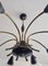 Lámpara de araña Mid-Century de ocho brazos en negro y latón atribuida a Stilnovo, Italia, años 50, Imagen 12