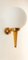 Gelbgoldene Wandlampe mit weißer Kugel von Stilnovo 1