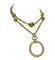 Goldene Vintage Halskette mit Lupenglas-Anhänger oben und Kugel-Anhängern von Chanel 1