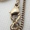 Collier pendentif CHANEL strass here mark coeur 4 rangs 9