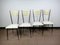 Mid-Century Esszimmerstühle aus schwarz lackiertem Metall, Messing & weißem Kunstleder, 1950er, 4er Set 1