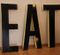 Large Vintage French Industrial Black & Yellow Lacquered Metal EAT Letter Set, 1950s 1