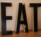 Large Vintage French Industrial Black & Yellow Lacquered Metal EAT Letter Set, 1950s, Image 1