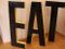 Large Vintage French Industrial Black & Yellow Lacquered Metal EAT Letter Set, 1950s 3