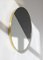 Mittelgroßer runder getönter Dualis Orbis Spiegel im Messingrahmen von Alguacil & Perkoff Ltd 1