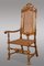 Antiker spanischer Armlehnstuhl aus geschnitztem Nussholz 1