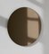 Kleiner runder bronzefarbener Orbis Spiegel von Alguacil & Perkoff Ltd 1