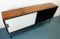 Rosewood Sideboard with White and Black Sliding Doors, 1960s 12
