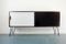 Rosewood Sideboard with White and Black Sliding Doors, 1960s, Image 1