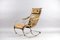 Antique Leather and Metal Rocking Chair by Peter, Cooper for R.W. Winfried 13