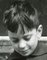 Boy Reading a Newspaper, Italy, 1956 2