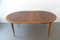 Extendable Round Walnut and Brass Dining Table by José Cruz de Carvalho for Altamira, 1950s 1
