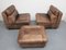 Set aus braunen Patchwork Sesseln und Hockern aus Leder, 1970er 7