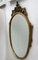 Italian Ornate Carved Giltwood Oval Wall Mirror, 1960s 6