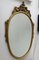 Italian Ornate Carved Giltwood Oval Wall Mirror, 1960s 8