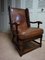 English Cognac Leather & Oak Wingback Armchair from Criterion Cord Chairs & Settees, 1960s, Image 1