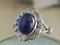 18 Carat White Gold, Sapphire Cabochon, and Diamond Ring 1