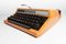 Orangefarbene Reed 100 Schreibmaschine aus Silber von Seiko co. Ltd, 1970er 9