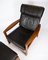 Easy Chair with Stool in Teak Upholstered with Black Leather by Arne Vodder for Komfort, Set of 2 2