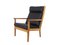 GE 265 Oak and Black Leather Armchair by Hans J. Wegner for Getama, 1980s, Immagine 1