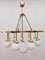Brass Chandelier with 10 White Globe Lights, Image 1