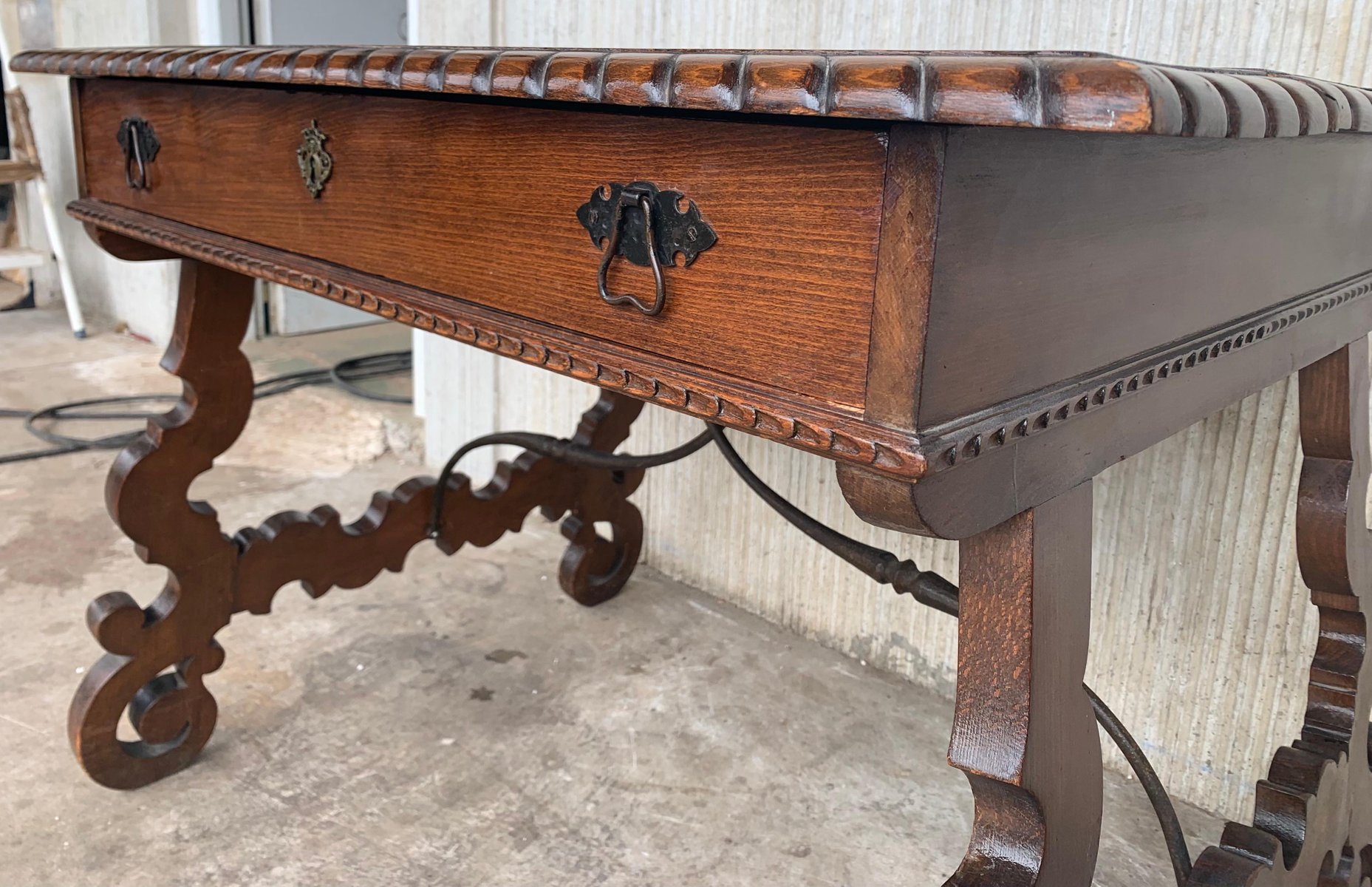 Early 20thCentury Spanish Desk with Lyre Legs and Carved Edges on Top