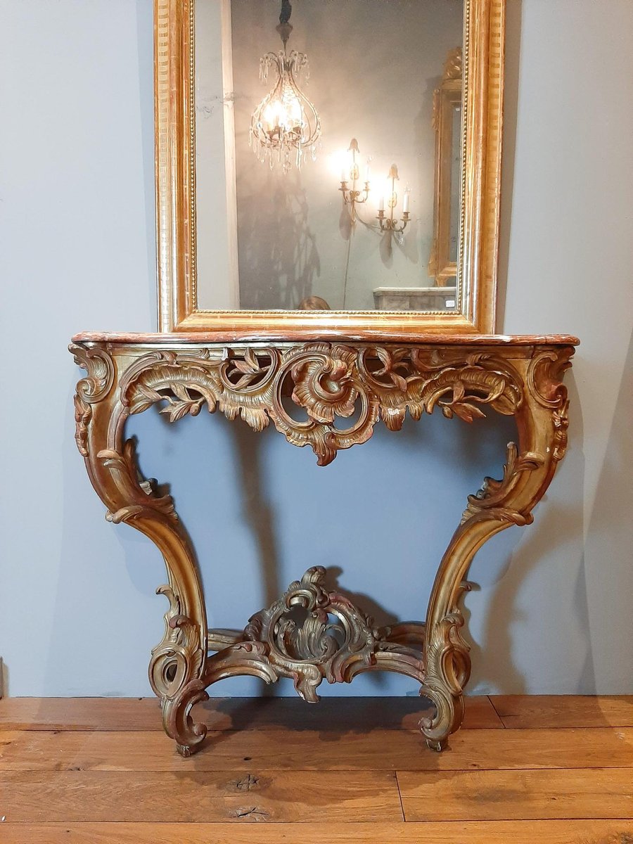 Consola Rococo Consola rococó de madera dorada con tablero de mármol rojo, siglo XIX ...