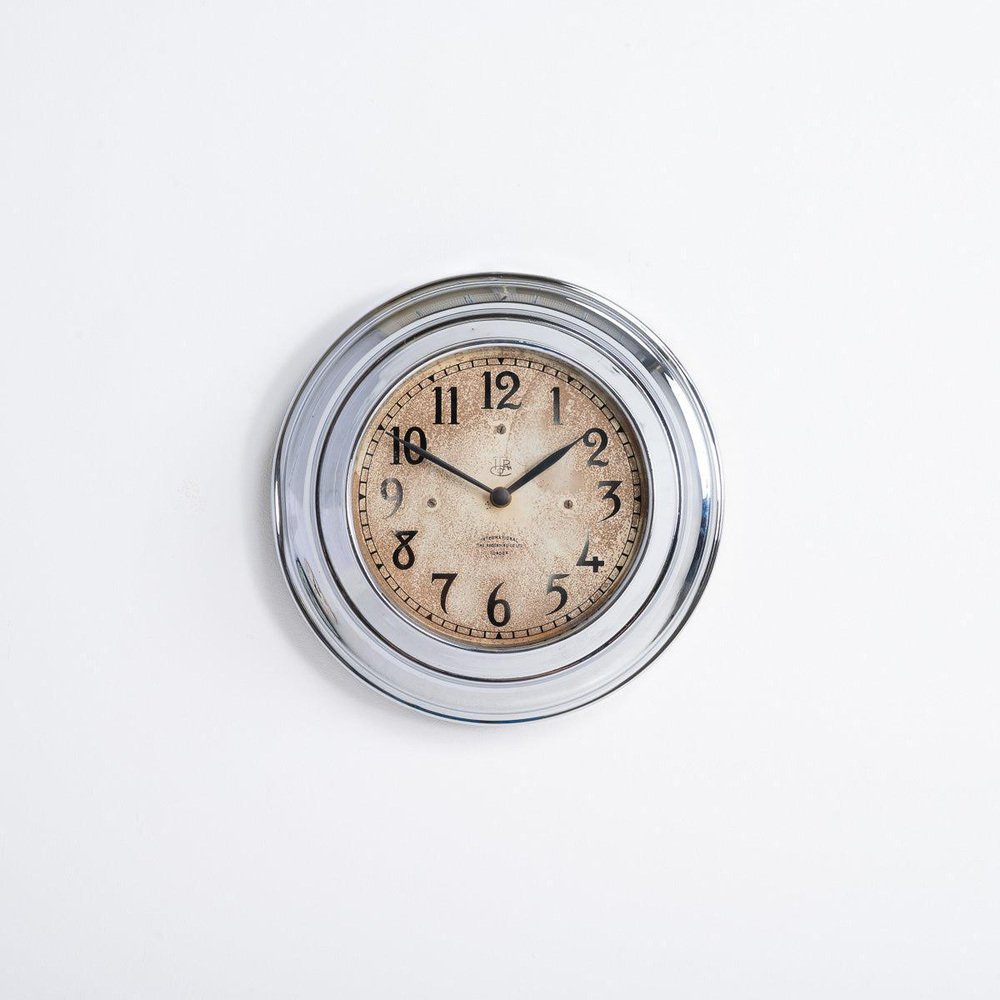 Small Wall Clock in Chrome from International Time Recording Co Ltd