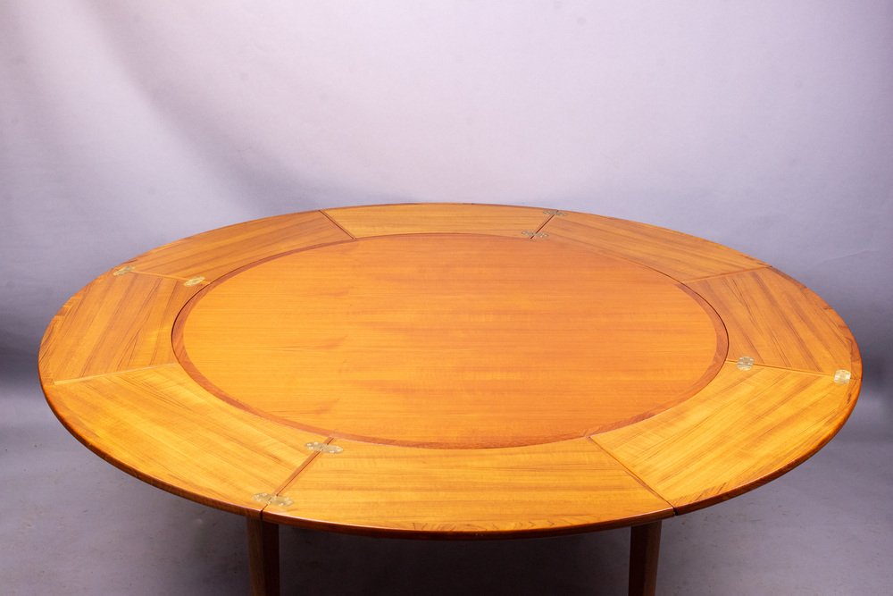 round-extendable-flip-flap-lotus-teak-dining-table-from-dyrlund-1970s