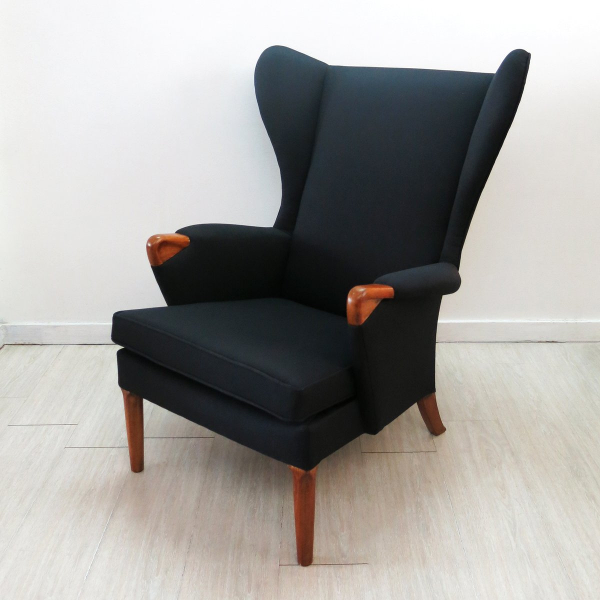 Black Wingback Chair with Teak Legs from Parker Knoll, 1960s for sale