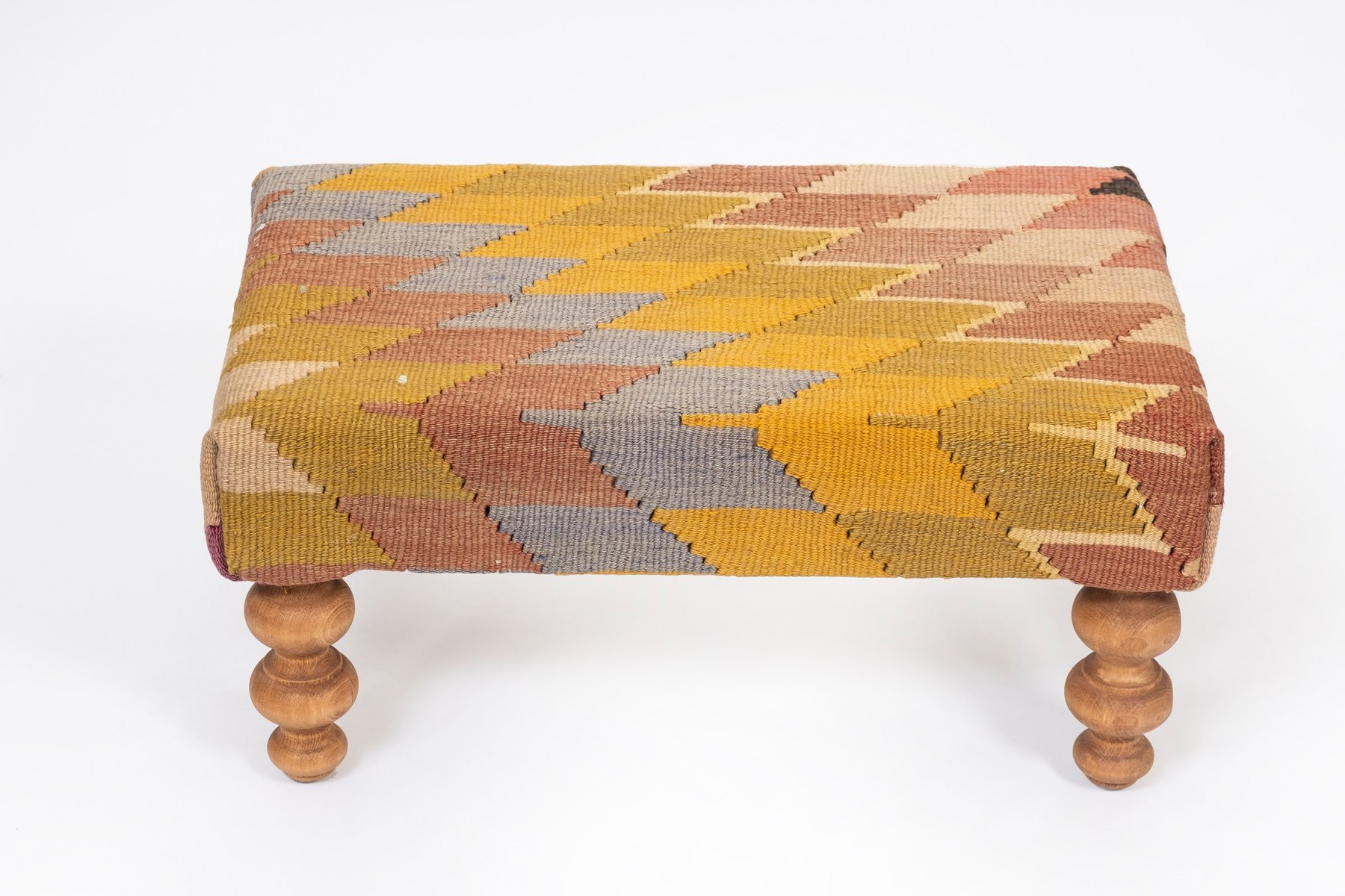 Small Kilim Ottoman with Wooden Legs for sale at Pamono