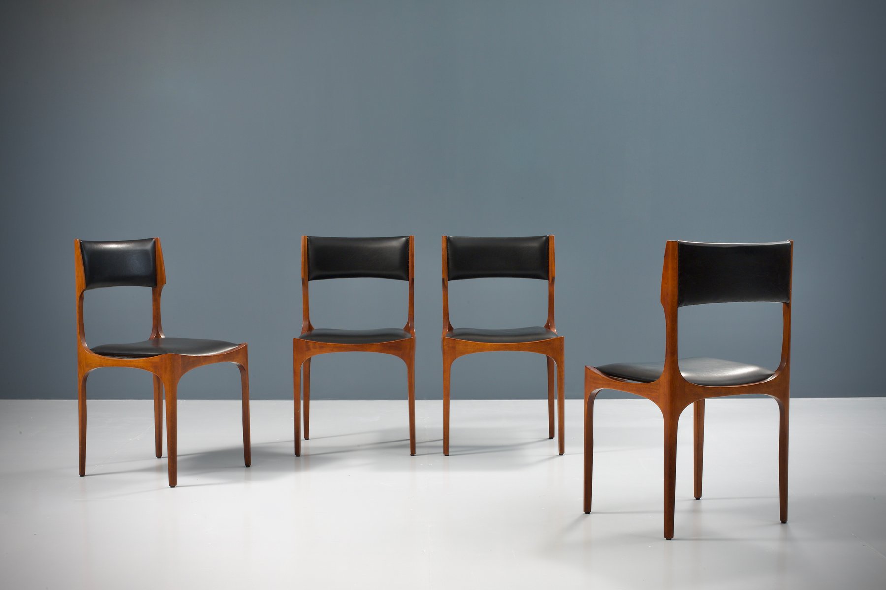 4 faux leather dining chairs