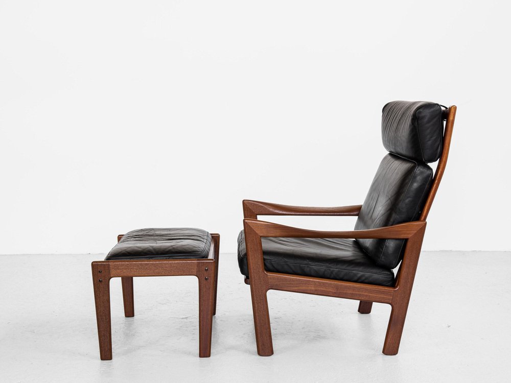 Midcentury Danish lounge chair and ottoman in teak and leather by Illum